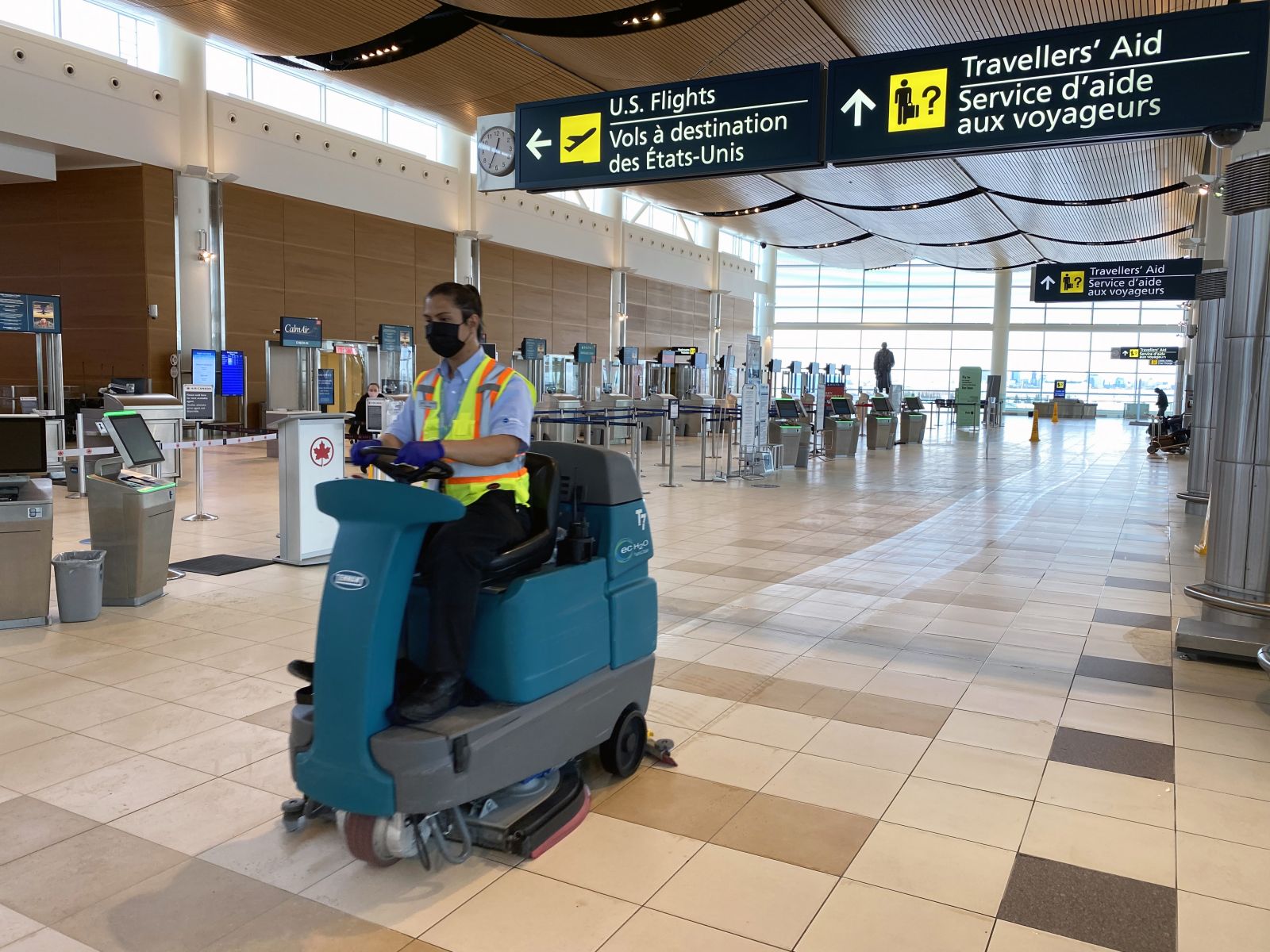 Team member cleaning the floors on the departures level