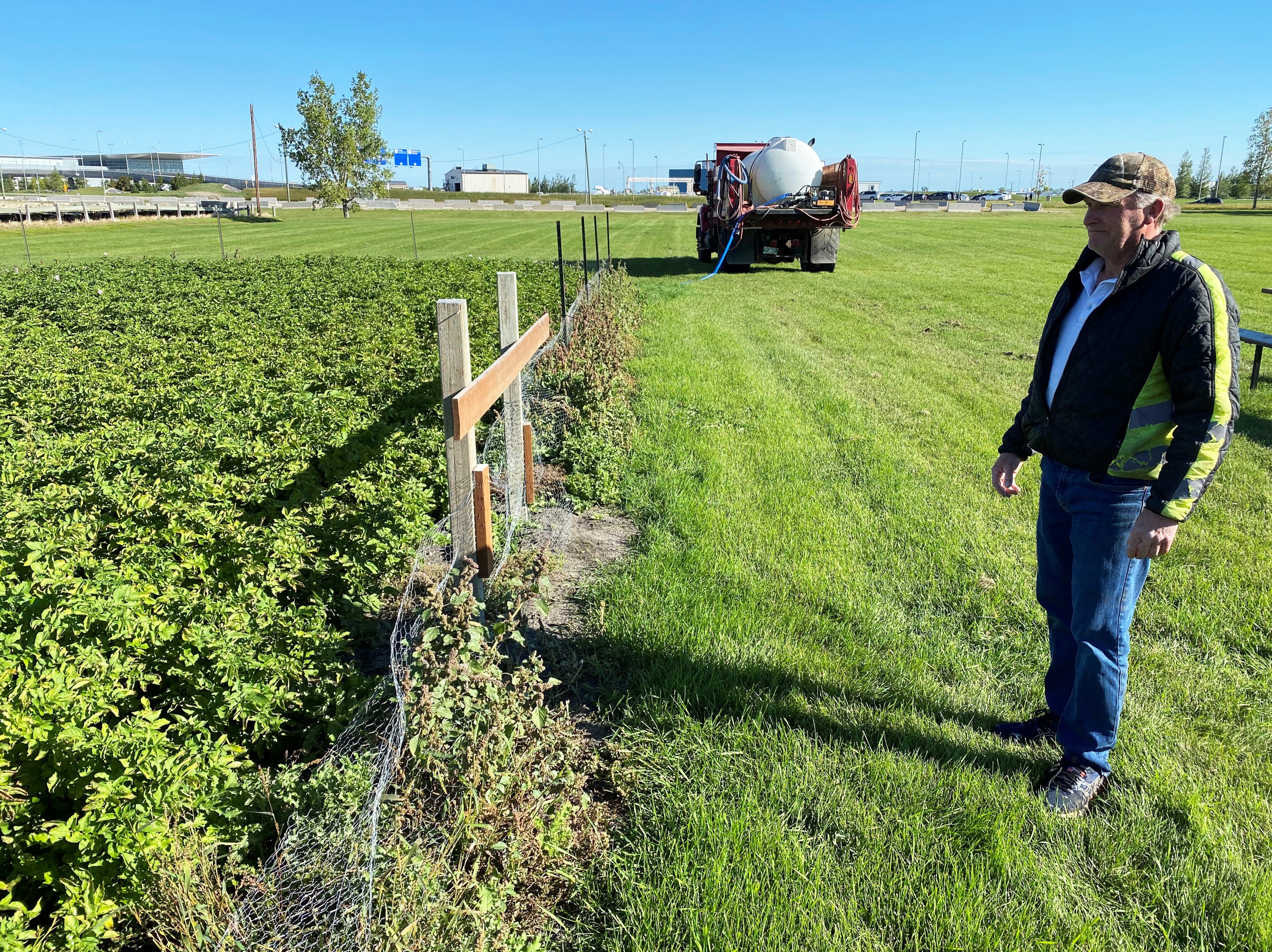 Patrick Grose of the airport's groundside maintenance team surveys the Harvest Garden